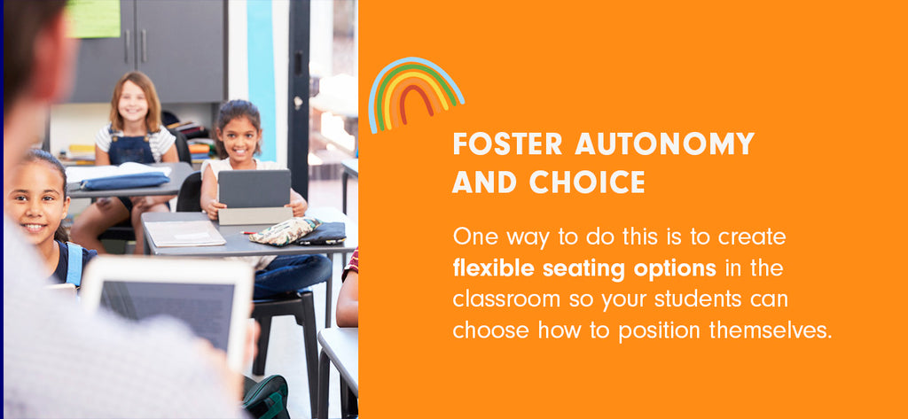 Three young students with tablets in a classroom