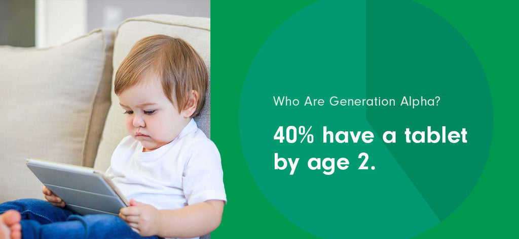 A Generation Alpha toddler uses a tablet